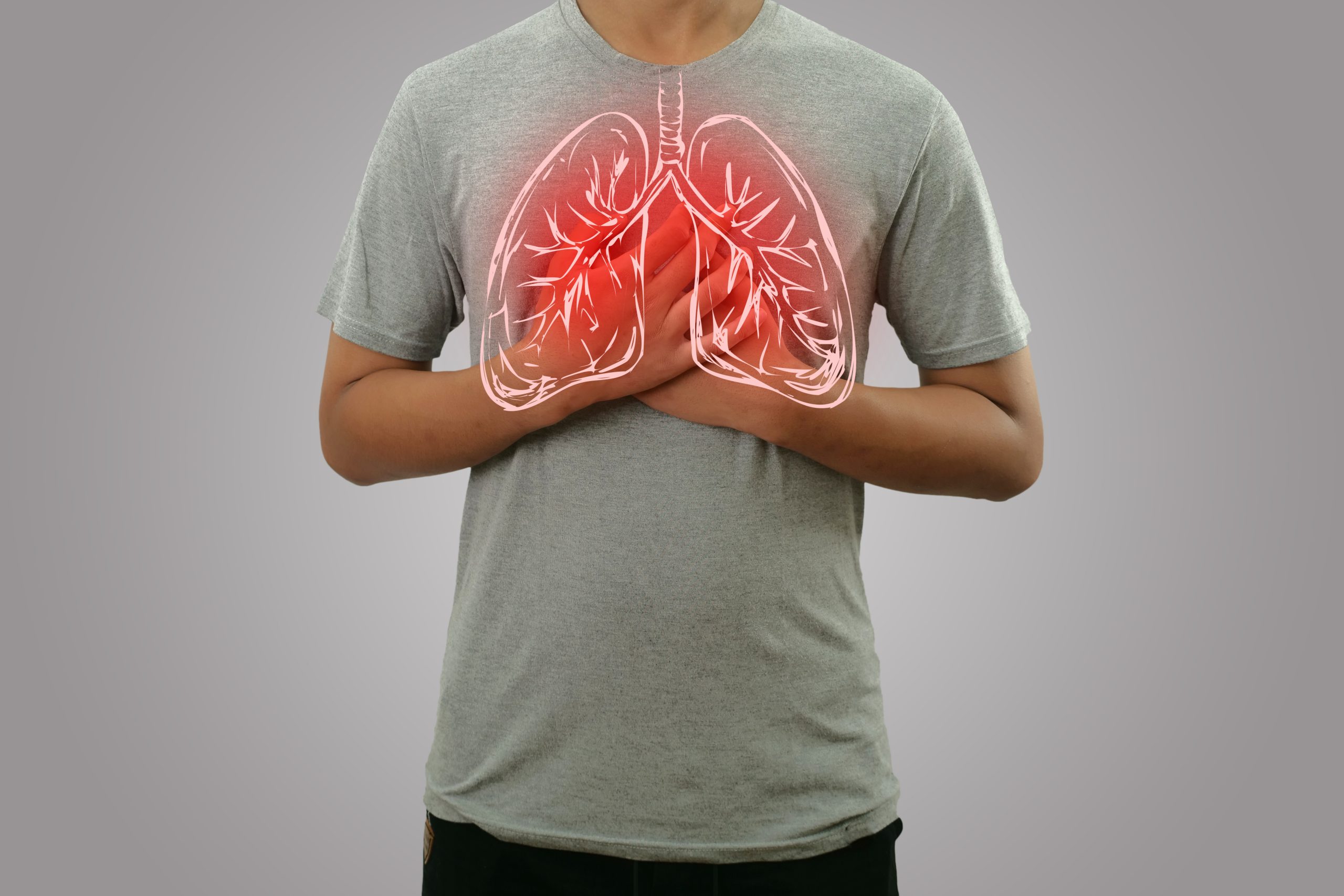 Male person holding chest, feeling pain with lung illustration on the torso, respiratory system disease